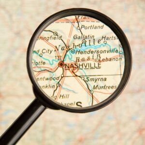 a map of Tennessee with a magnifying glass over Nashville