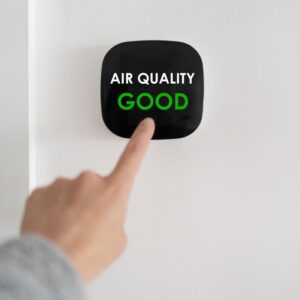 a black indoor air quality reader saying that the air quality is good
